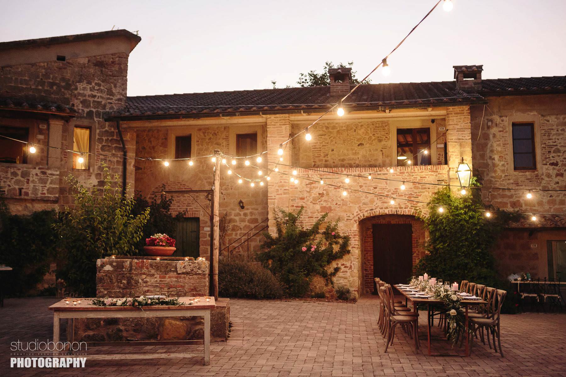 Rustic country chic intimate dinner decor at Tenuta di Papena and Roofless Abbey of San Galagano